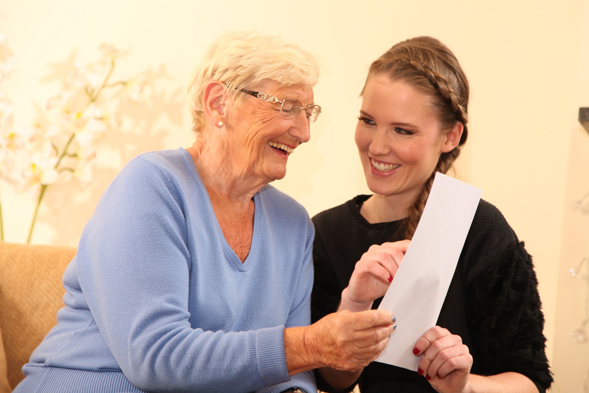 homecare caregiver and client laughing