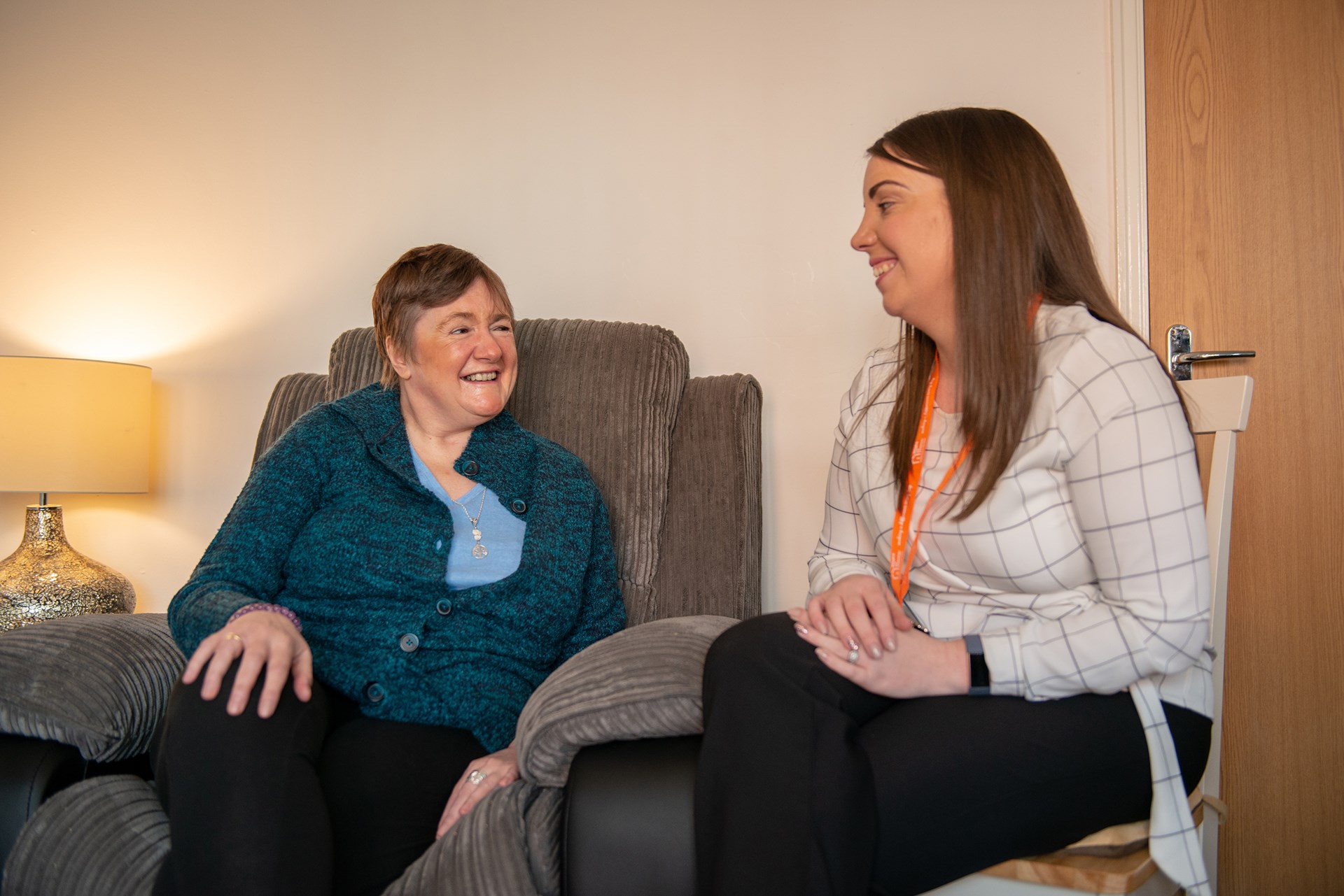 Client and CareGiver sitting down and speaking